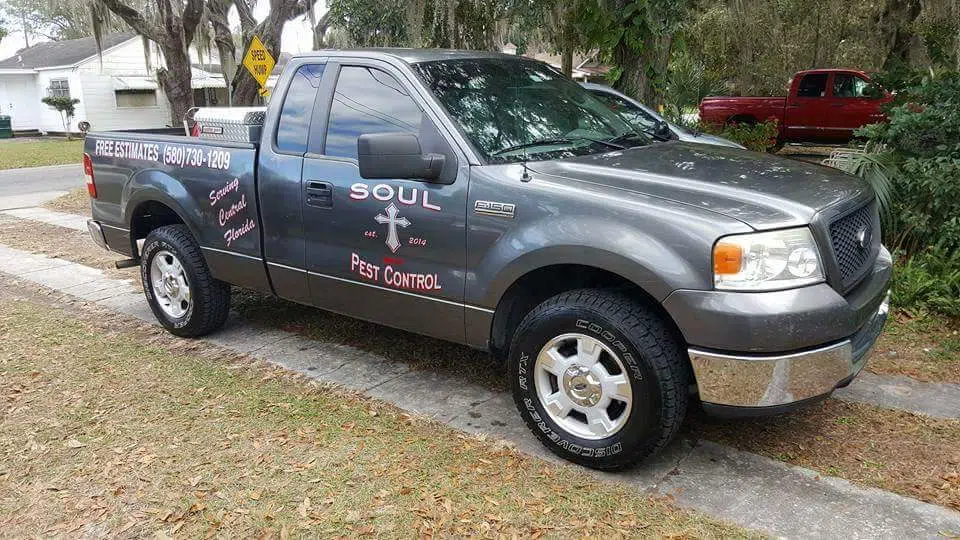 Gray branded work truck parked on a residential street — Soul Pest Control, Polk County, FL